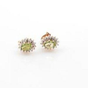 Sterling silver stud earrings with green stone in prong setting marked 925